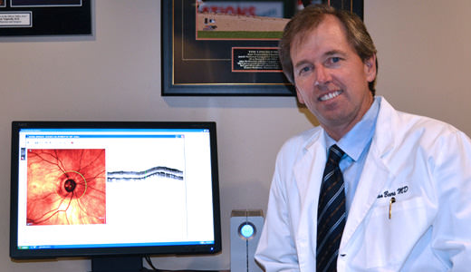 Dr. Beers reviewing a patients glaucoma results